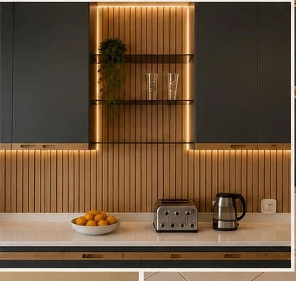 Detail — Hand-painted cabinetry in soft grey, paired with a wood-panel backsplash, stone countertops and warm under-cabinet lighting.